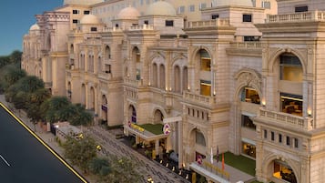 A large, historic building with multiple domes and arched windows, likely a hotel or cultural landmark.
