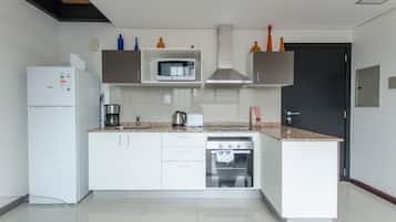 Business Loft | Private kitchen | Full-sized fridge, microwave, oven, stovetop