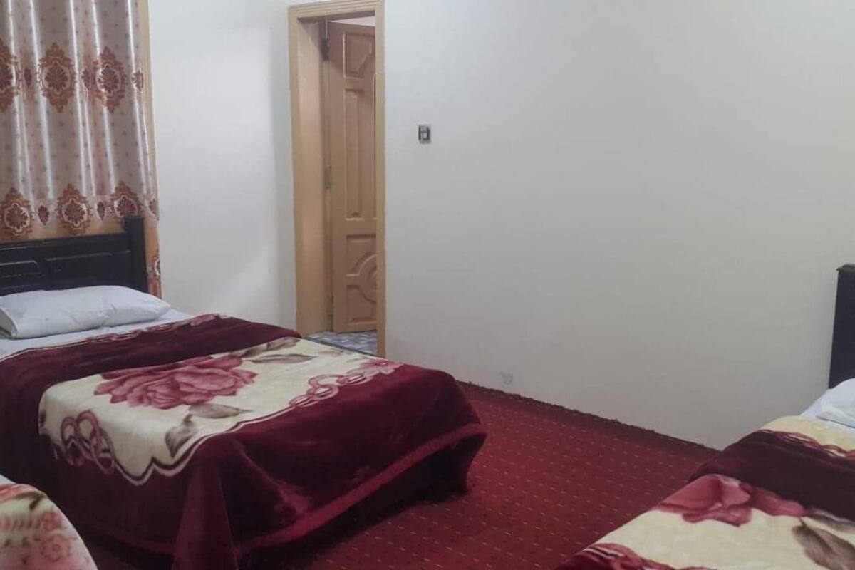 Comfort Triple Room | Down comforters, blackout drapes, iron/ironing board, rollaway beds