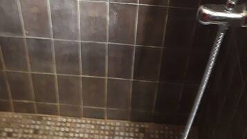 Shower, rainfall showerhead, towels, soap