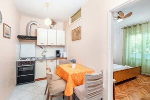 Apartment (A2) | Private kitchen | Fridge, stovetop, cookware/dishes/utensils - Apartments Jelica (Pag)