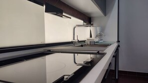 Apartment (A1) | Private kitchen | Fridge, stovetop, cookware/dishes/utensils