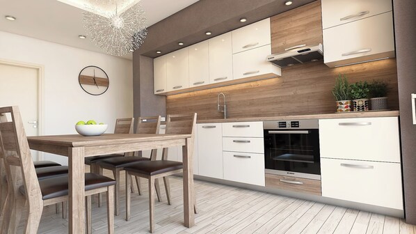 Une cuisine moderne avec des meubles blancs, un four Bosch et un coin repas comprenant des chaises et une table en bois.