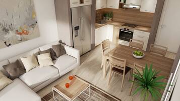 A modern kitchen with a refrigerator, oven, and dining area.