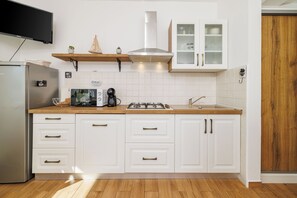 Apartment (A1) | Private kitchen | Fridge, stovetop, cookware/dishes/utensils - Apartments Iva (Crikvenica)