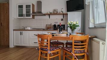 Apartment (A2) | Private kitchen | Fridge, stovetop, cookware/dishes/utensils