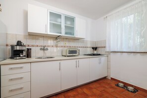 Apartment (A3) | Private kitchen | Fridge, stovetop, cookware/dishes/utensils - Apartments Iva (Crikvenica)