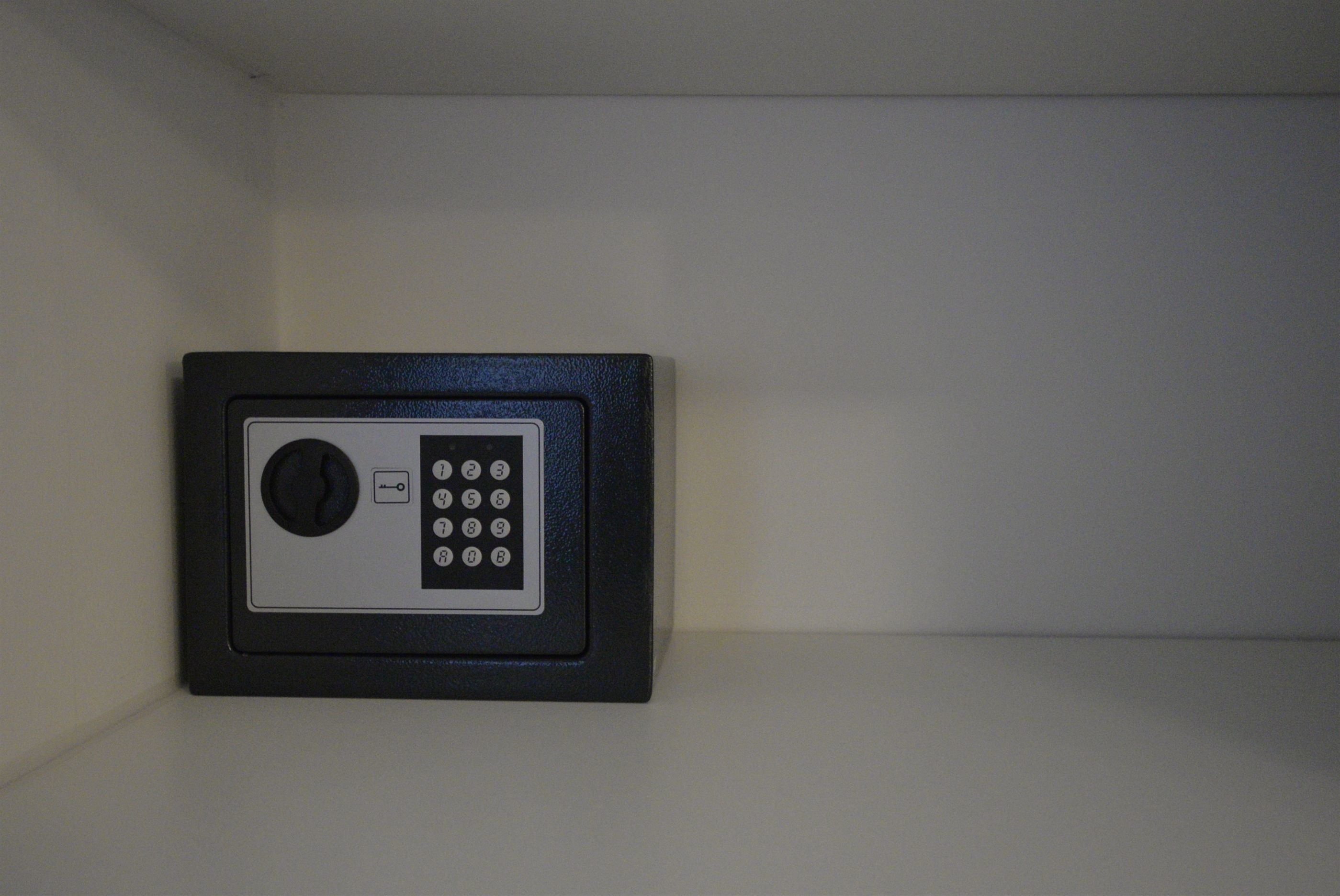 A keypad lock on a wall.