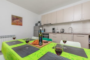 Apartment (A1) | Private kitchen | Fridge, microwave, oven, stovetop - Apartment Adrian (Omis)