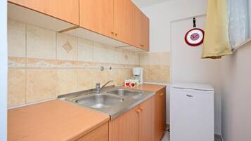 Estúdio (A2) | Cozinha privada | Frigobar, cooktop, máquina de café expresso