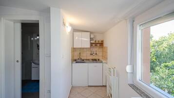 Estúdio (A1) | Cozinha privada | Frigobar, cooktop, máquina de café expresso