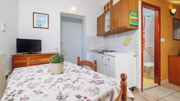 Apartamento (A6) | Cozinha privada | Geladeira, cooktop, máquina de café expresso