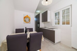 Apartment (A2) | Private kitchen | Fridge, oven, stovetop, espresso maker - Apartments Marina (Lopar)