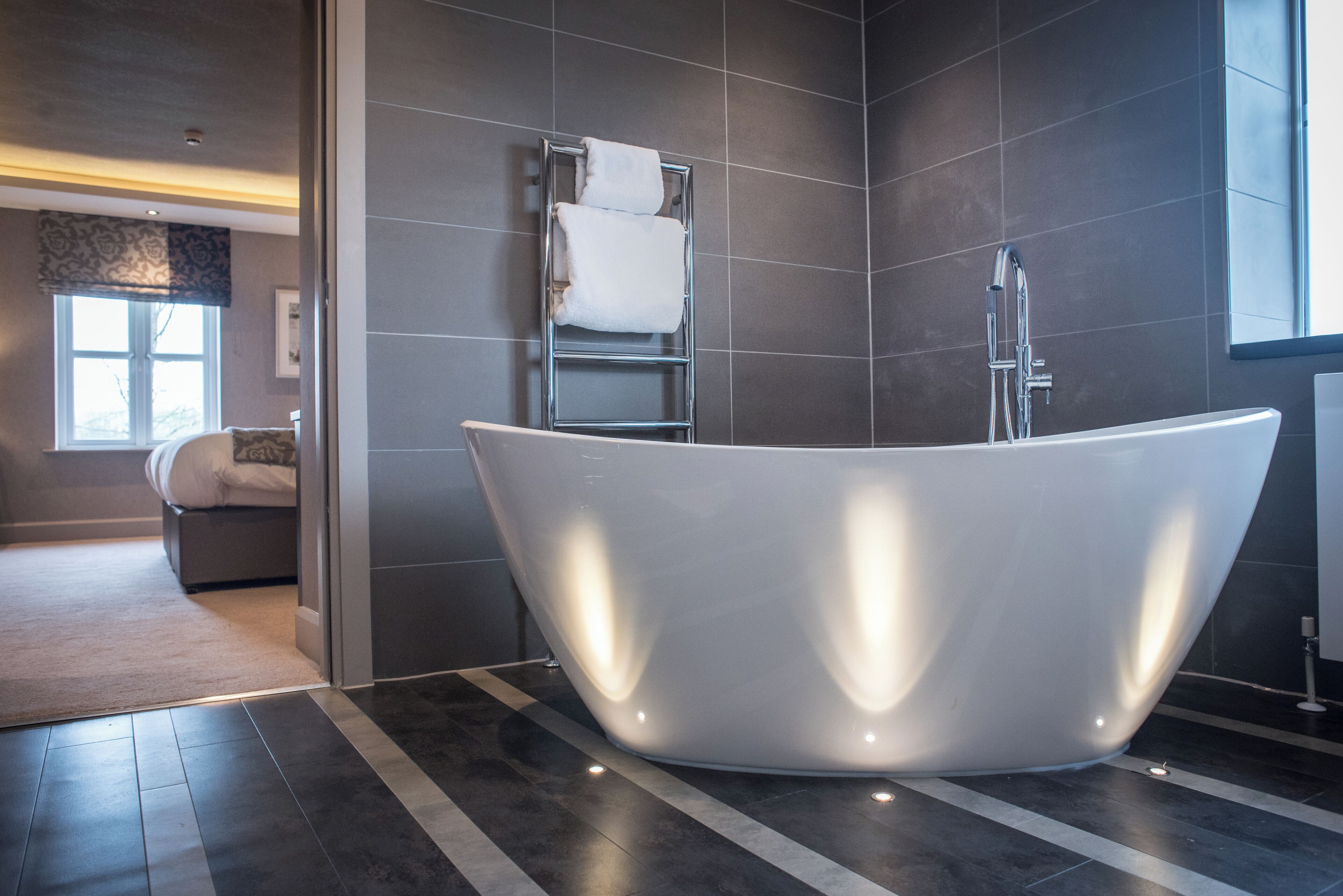 superior suite | bathroom | shower, free toiletries, hair dryer, towels