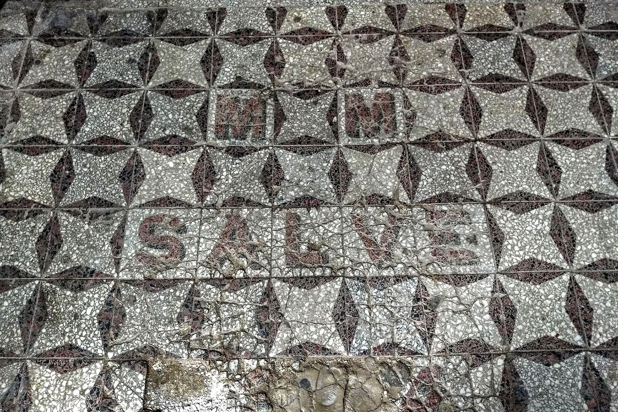 A mosaic floor with a geometric pattern.