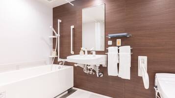 Differently Abled Room, Non Smoking | Bathroom | Combined shower/tub, deep soaking tub, free toiletries, hair dryer