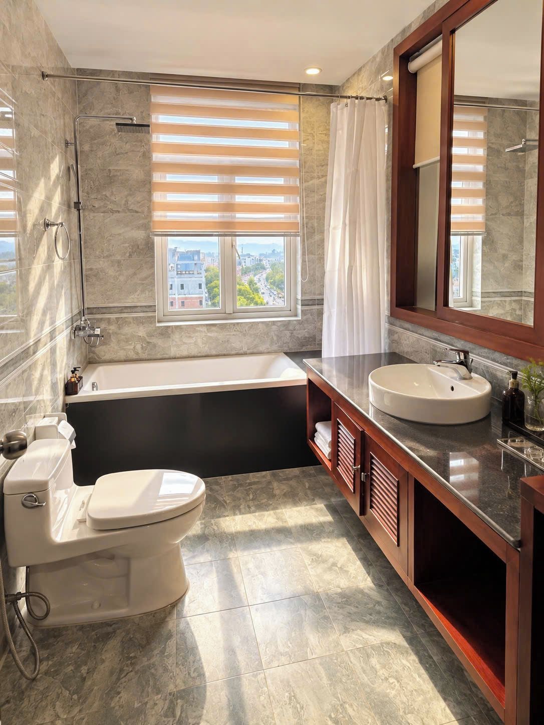 Un baño moderno con bañera, inodoro y lavamanos.