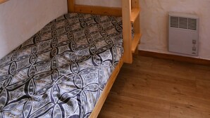 A bunk bed with patterned bedding, a window with a view, and a wall-mounted air conditioner. - GRAND CAP 1 - APPT 4 PERS TIGNES - PEACE AND NATURE (Tignes)