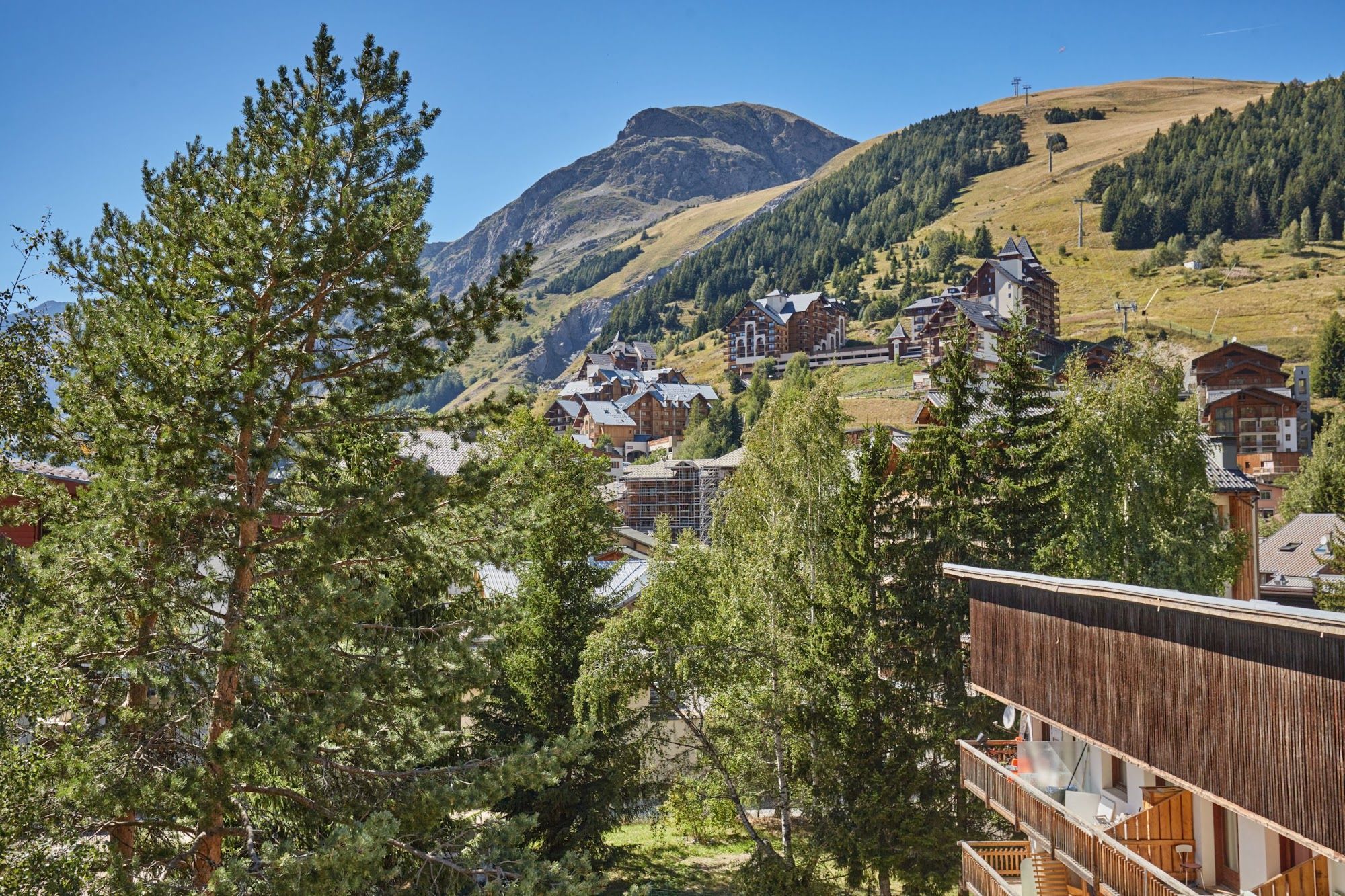 A mountainous landscape with a village and buildings.