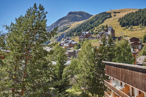 A mountainous landscape with a village and buildings.