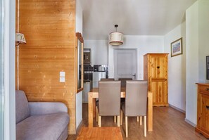 Living area with a wooden cabinet and wall decor