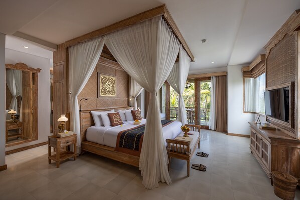A four-poster canopy bed with a wooden headboard, a bedside table with a lamp, and a large mirror.
