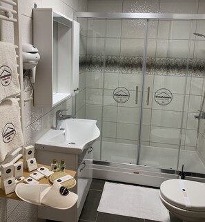 Shower, free toiletries, hair dryer, slippers