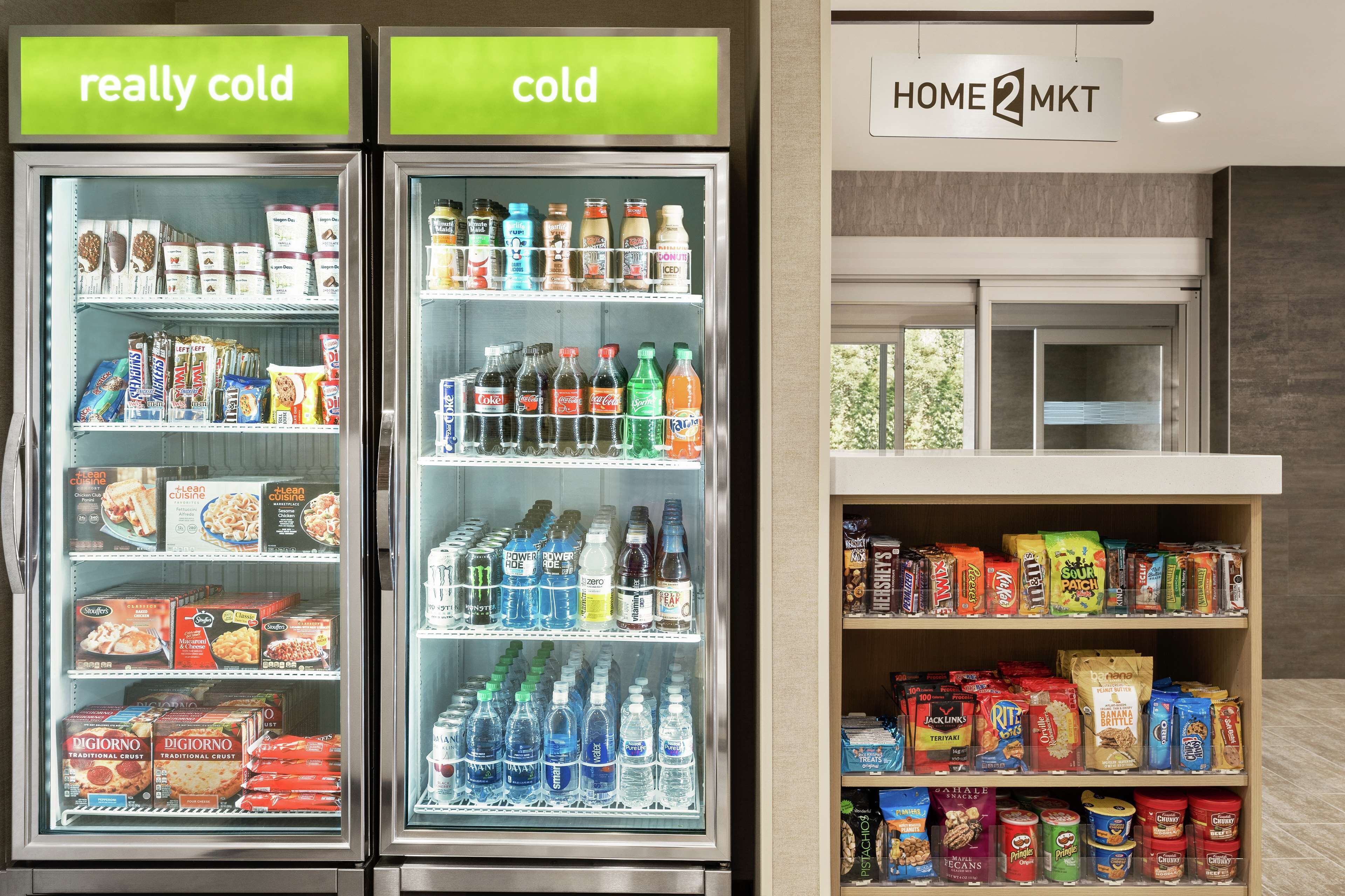 Two refrigerated display cases labeled "really cold" and "cold," stocked with various food items and beverages.