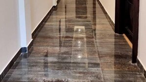 A long, narrow hallway with a polished marble floor and recessed ceiling lighting. - Parwati Retreat (Ranikhet)