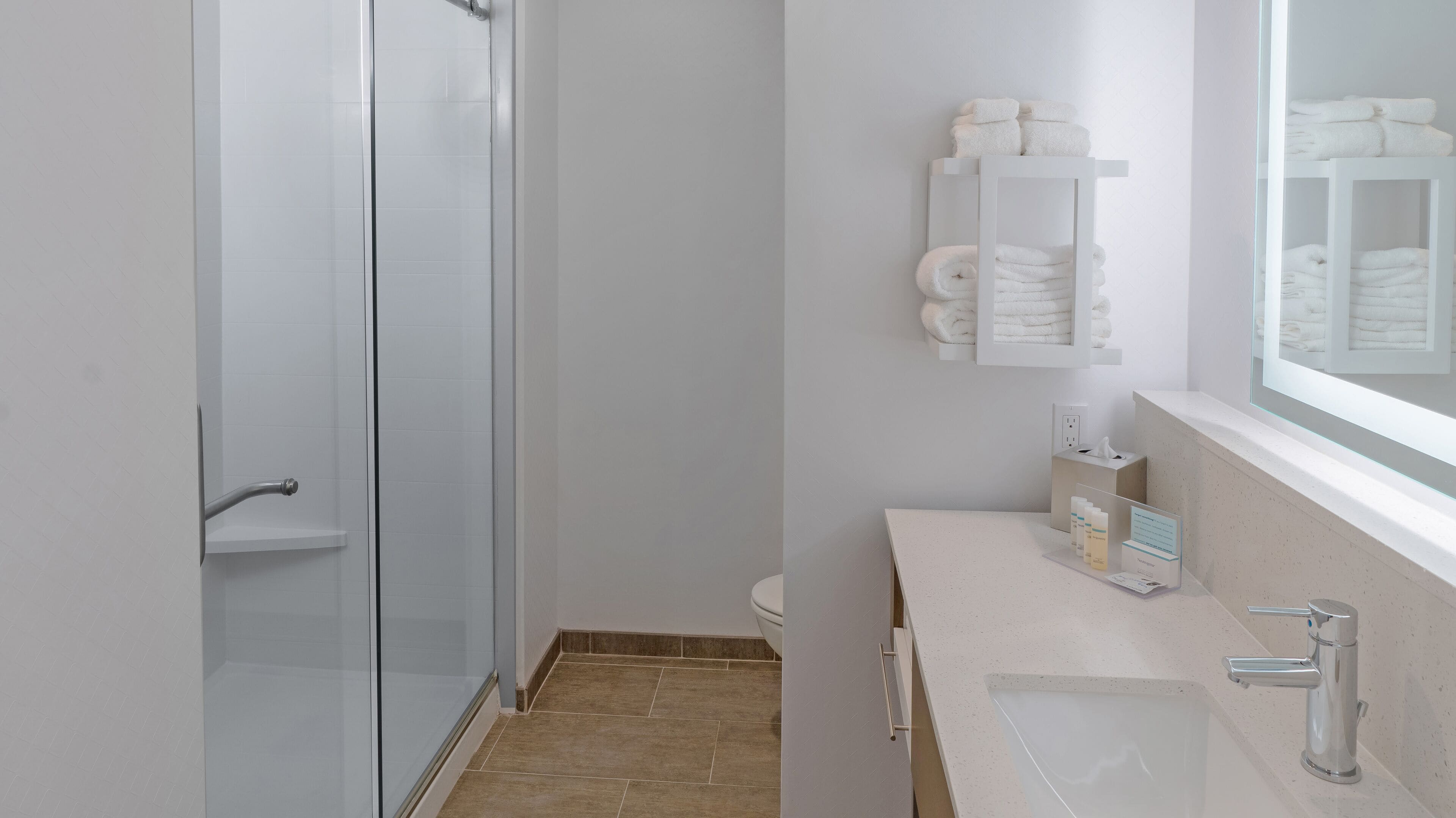 rainfall showerhead, designer toiletries, hair dryer, towels