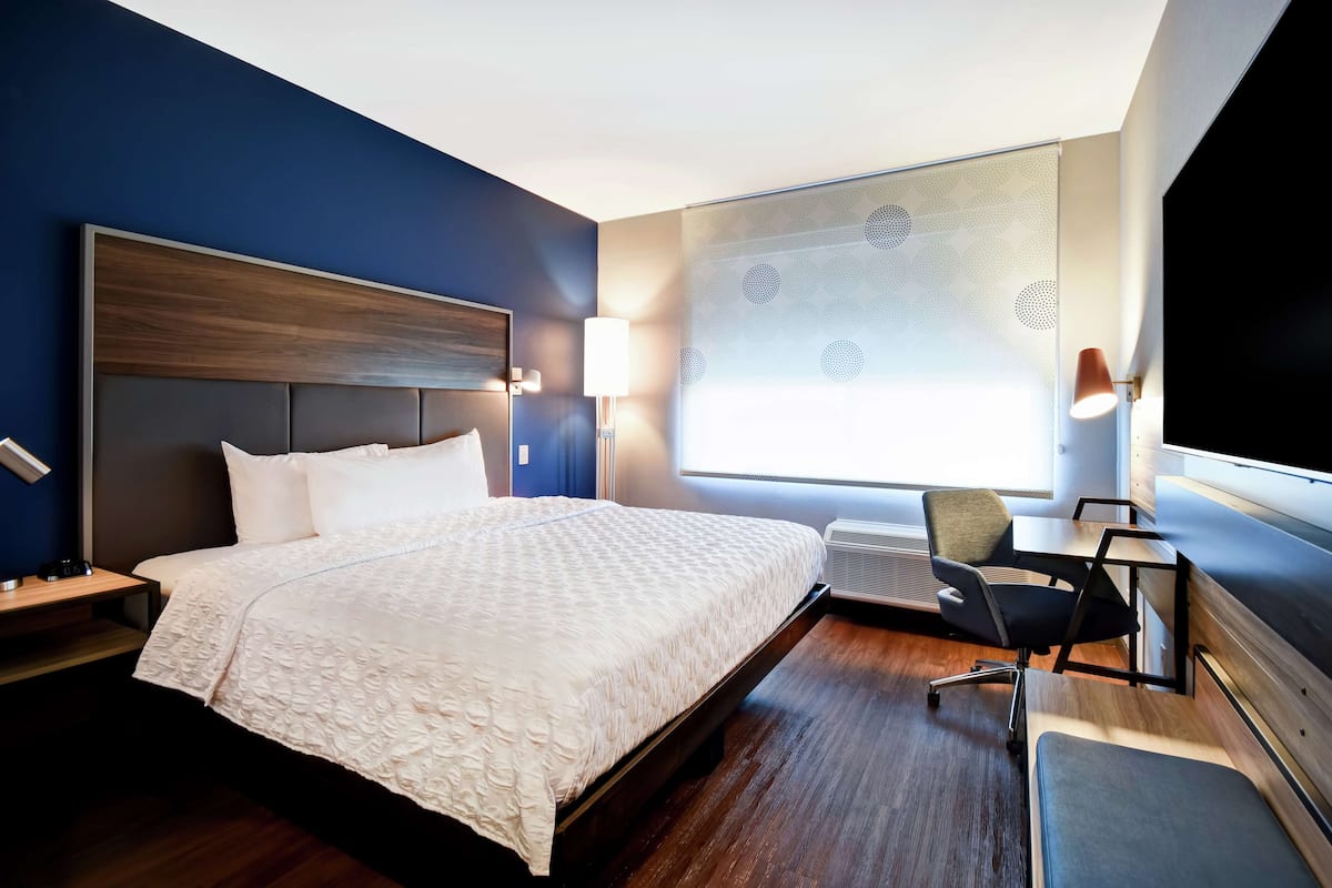 desk, laptop workspace, blackout curtains, iron/ironing board