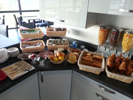Daily buffet breakfast for a fee. FastHotel Montmarault - Auberge du Grand Champ