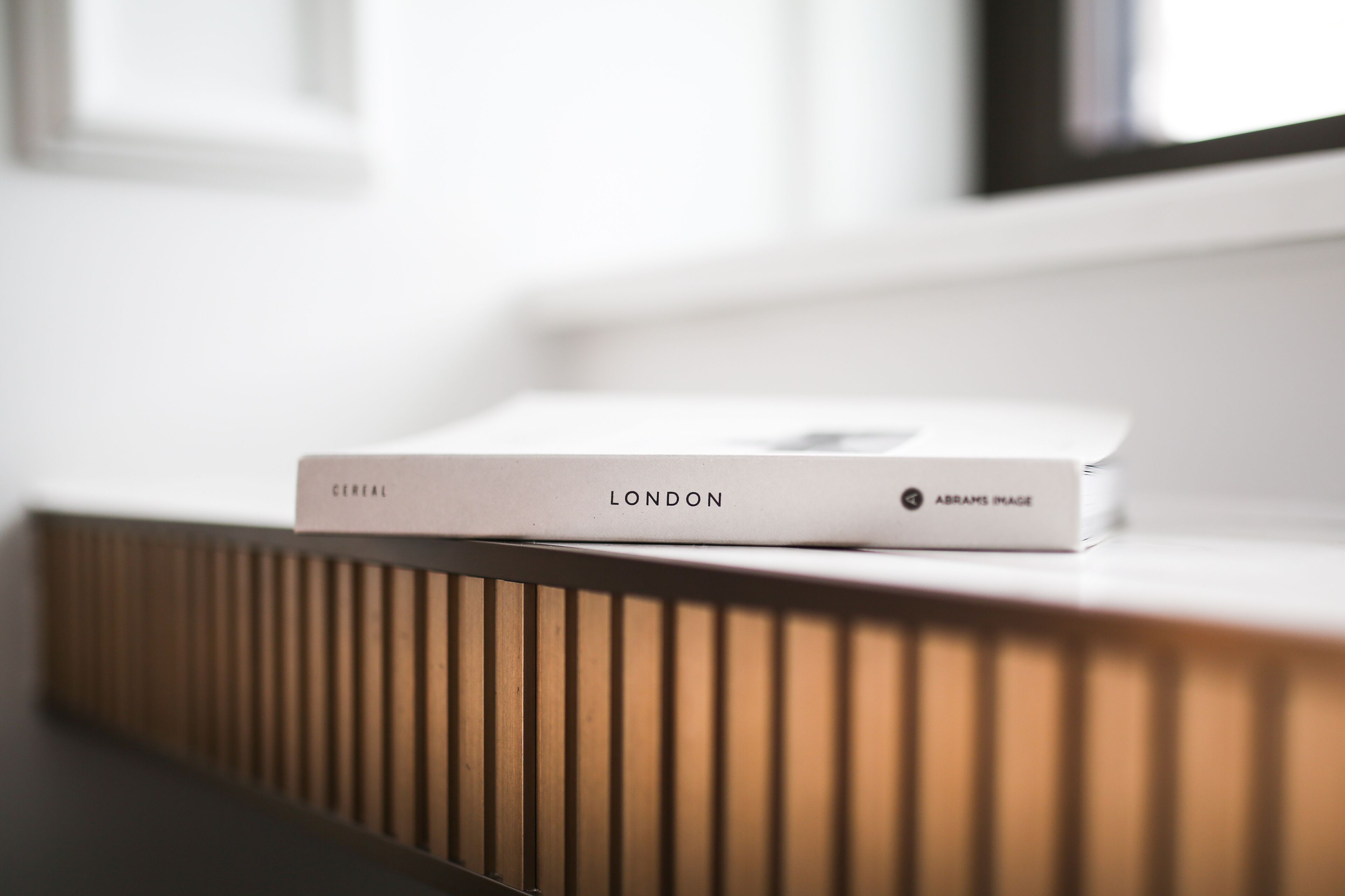 A white box labeled "Cereal" and "London" on a wooden surface.