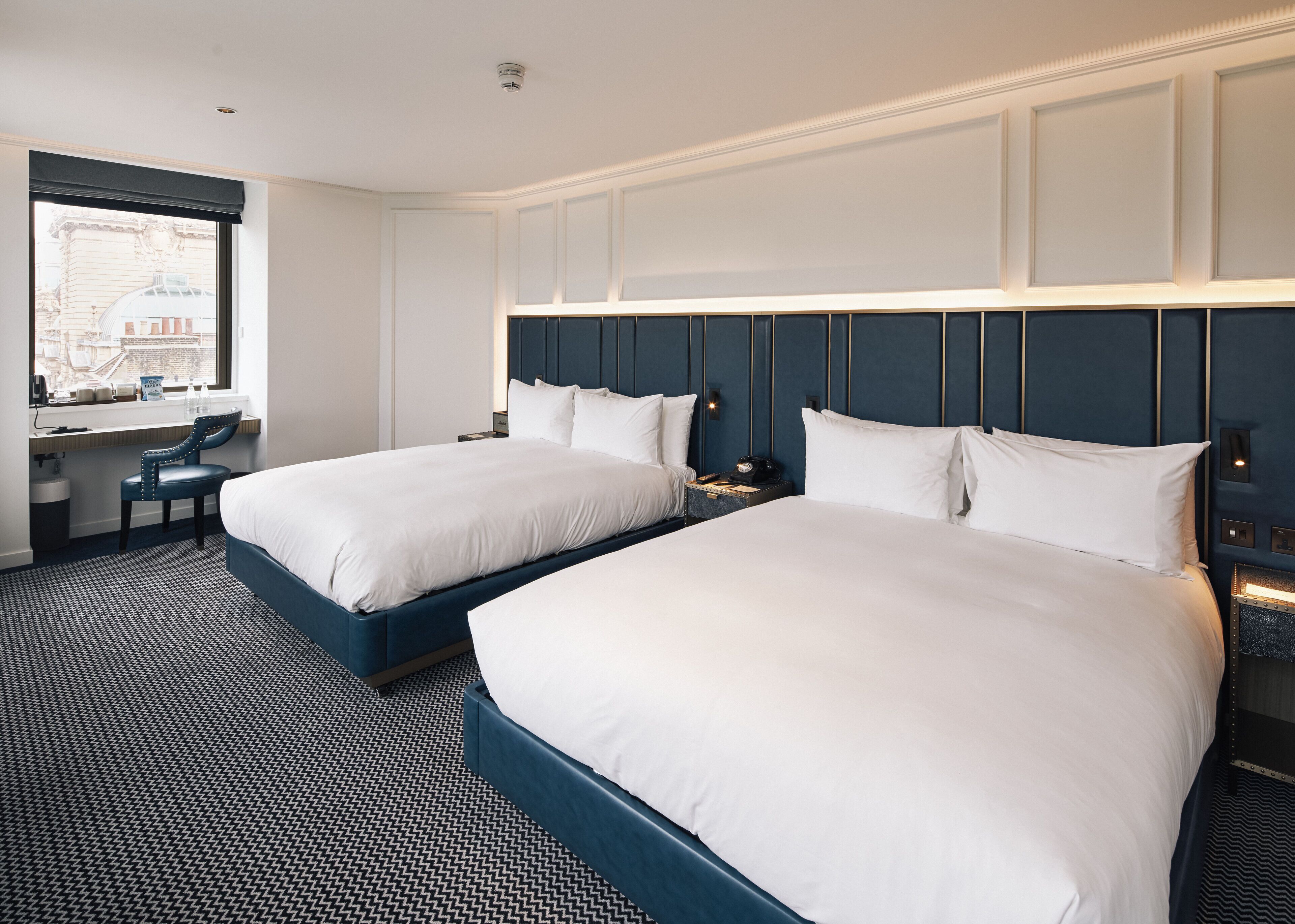 Hypo-allergenic bedding, free minibar items, in-room safe, desk