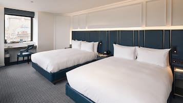 Hypo-allergenic bedding, free minibar items, in-room safe, desk