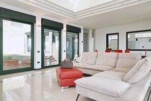 Exclusive Villa, 4 Bedrooms | Living area | Flat-screen TV, fireplace