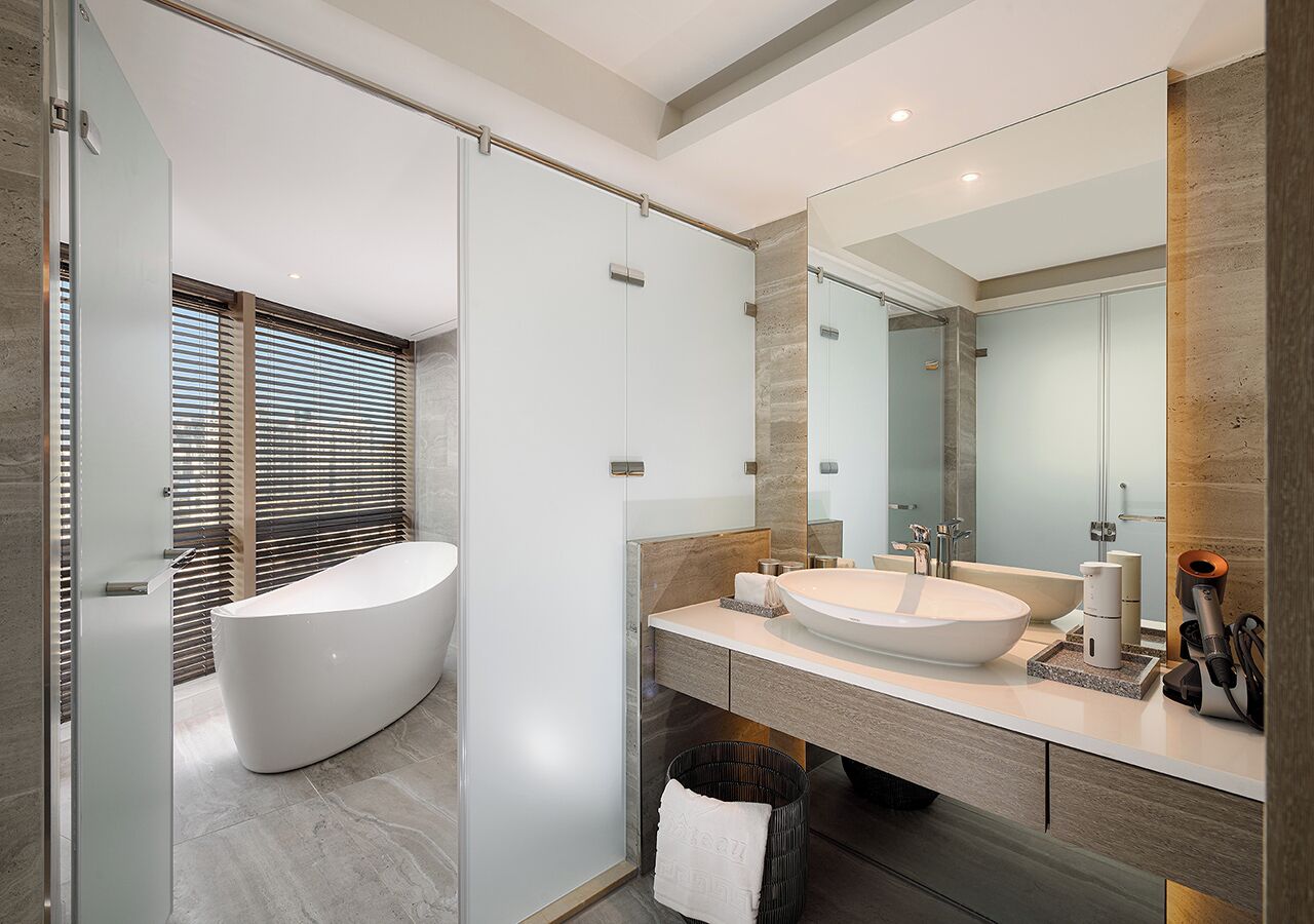 honeymoon corner suite | bathroom | slippers, towels