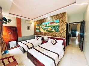 Luxury Family Room | Minibar, desk, blackout curtains, soundproofing - Cong Thuong Hotel (Da Nang)