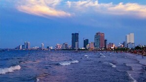 A coastal cityscape with a beach and high-rise buildings. - Cong Thuong Hotel (Da Nang)