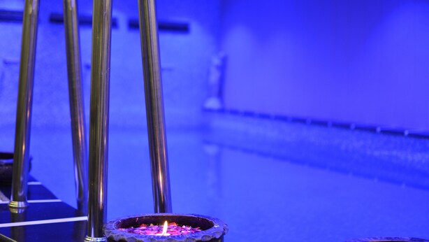 A metallic structure with a candle in a glass container. - Ashirwad Hotel and Spa (Mussoorie)