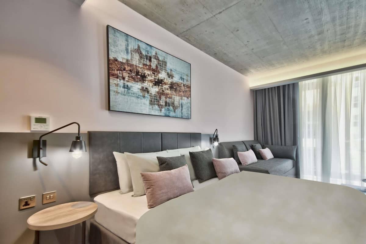 Junior Suite, Multiple Beds | In-room safe, desk, laptop workspace, soundproofing