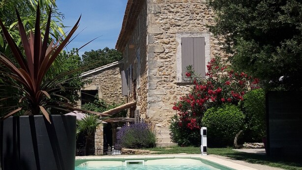 A stone building with a pool in front. - Duplex character cottage  (Grillon)