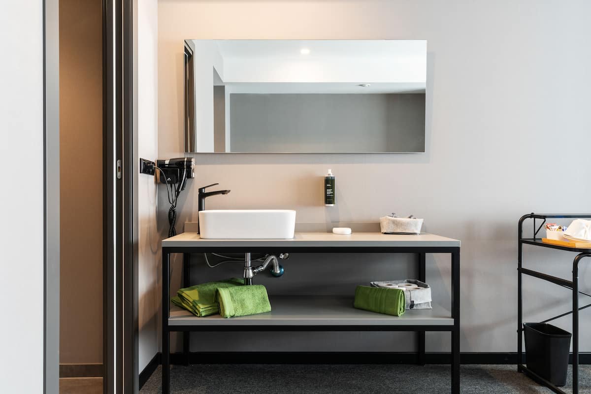 superior double room | bathroom | shower, hair dryer, towels