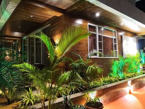 A modern building with wooden paneling and large windows.