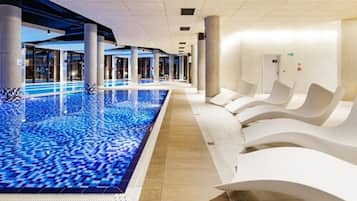 Indoor pool, open 10:00 AM to 10:00 PM, pool loungers