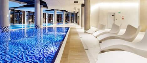 Indoor pool, open 10:00 AM to 10:00 PM, pool loungers