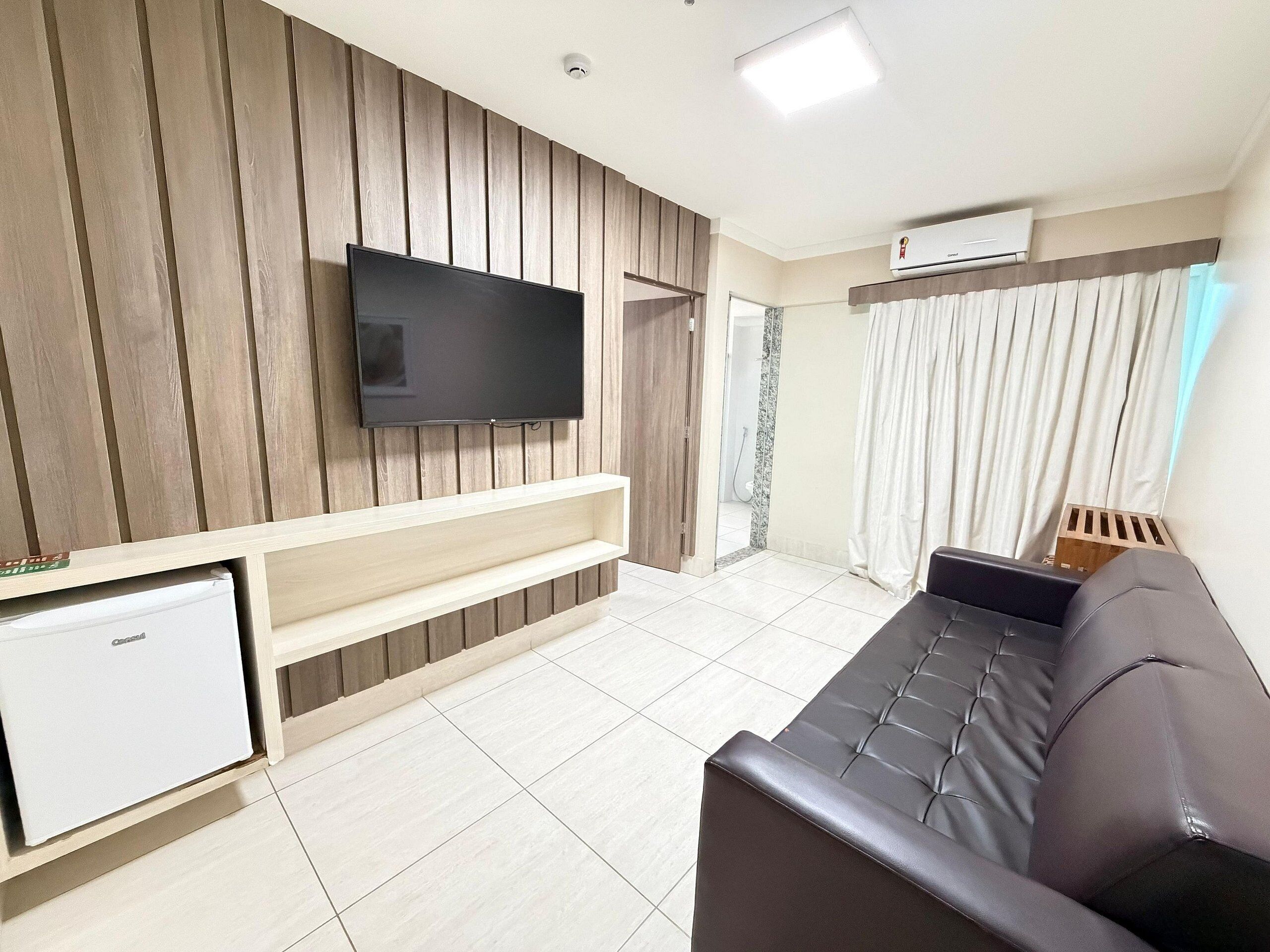 Basic Apartment | Living area | 20-inch plasma TV with cable channels, TV