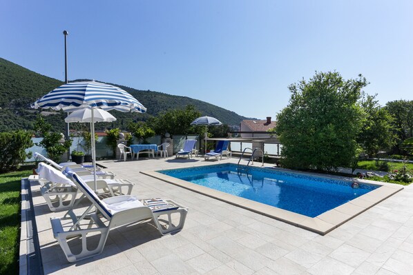 Seasonal outdoor pool, pool umbrellas, sun loungers