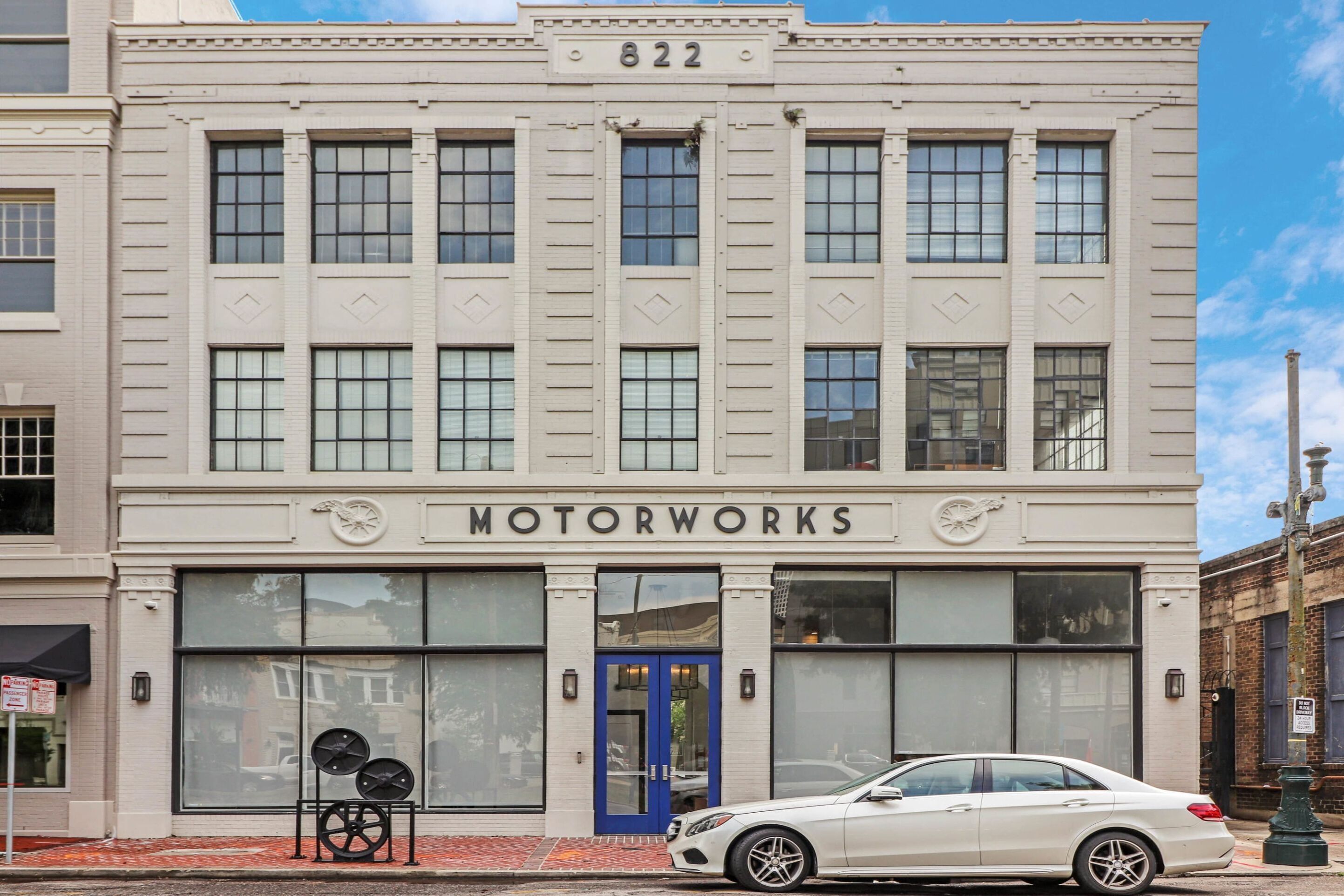 A building with the number 822 and the name MOTORWORKS on the facade.