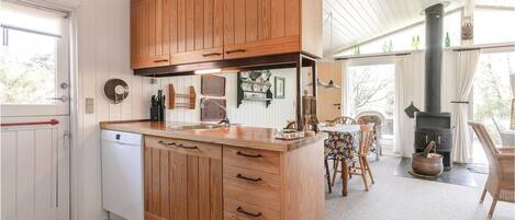 Fridge, stovetop, dishwasher, coffee/tea maker